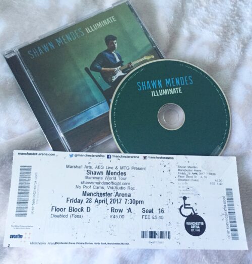 A photo of the Shawn Mendes illuminate album and my illuminate world tour ticket