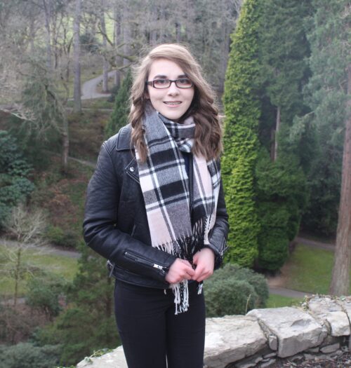 A photo of Elin with trees in the background