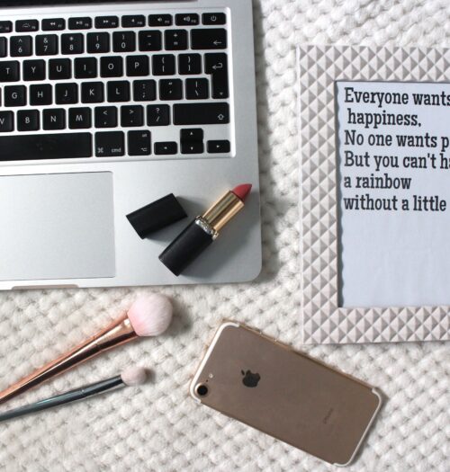 A photo of a macbook and a quote in a frame