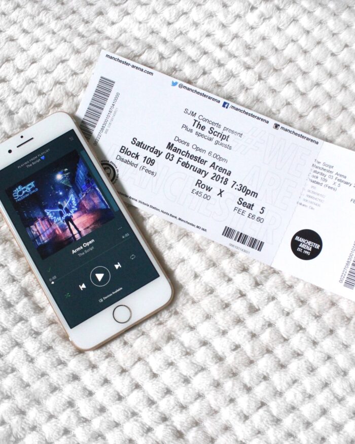 A photo of The Script concert ticket and one of their songs playing on my phone