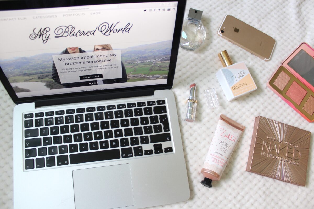 A photo of my blog on a macbook and beauty products beside it