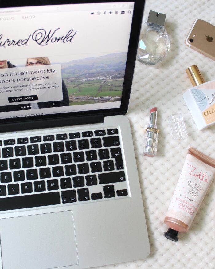 A photo of my blog on a macbook and beauty products beside it