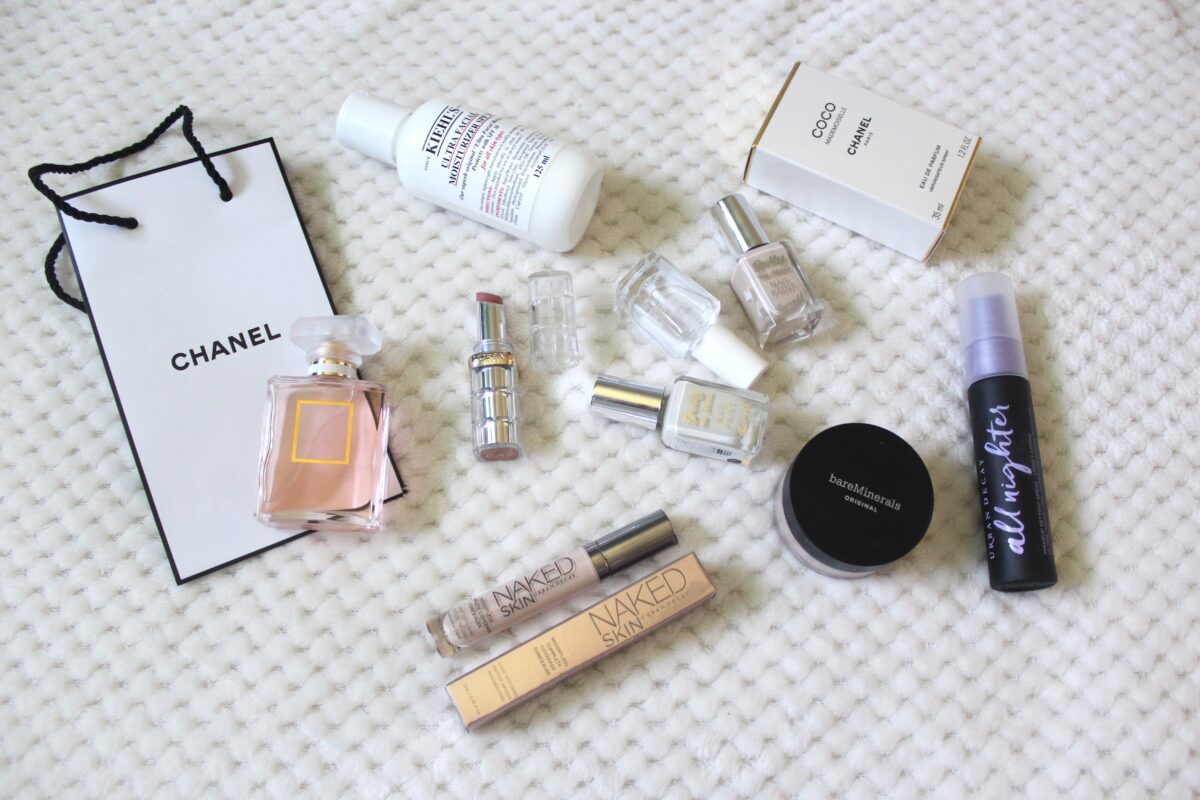 a photo of the chanel coco mademoiselle perfume with other beauty and makeup products beside it