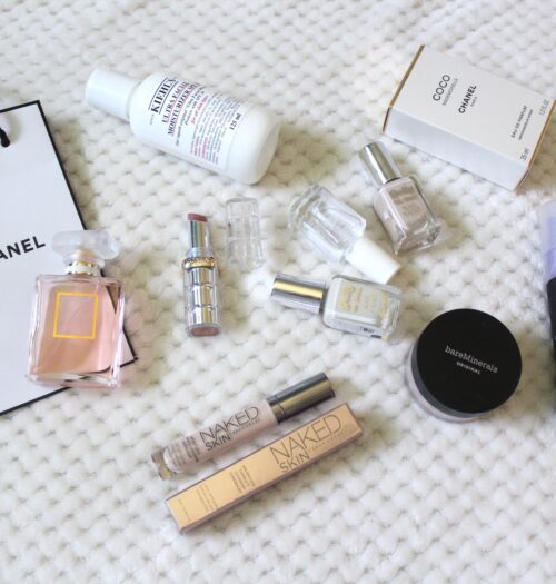 a photo of the chanel coco mademoiselle perfume with other beauty and makeup products beside it