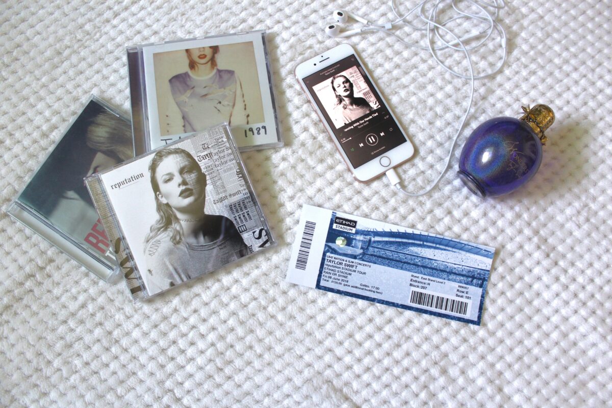 A photo of my Taylor Swift concert ticket, some of her albums and her wonderstruck perfume