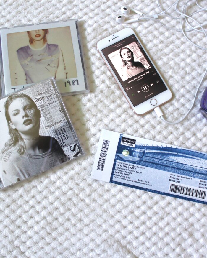 A photo of my Taylor Swift concert ticket, some of her albums and her wonderstruck perfume