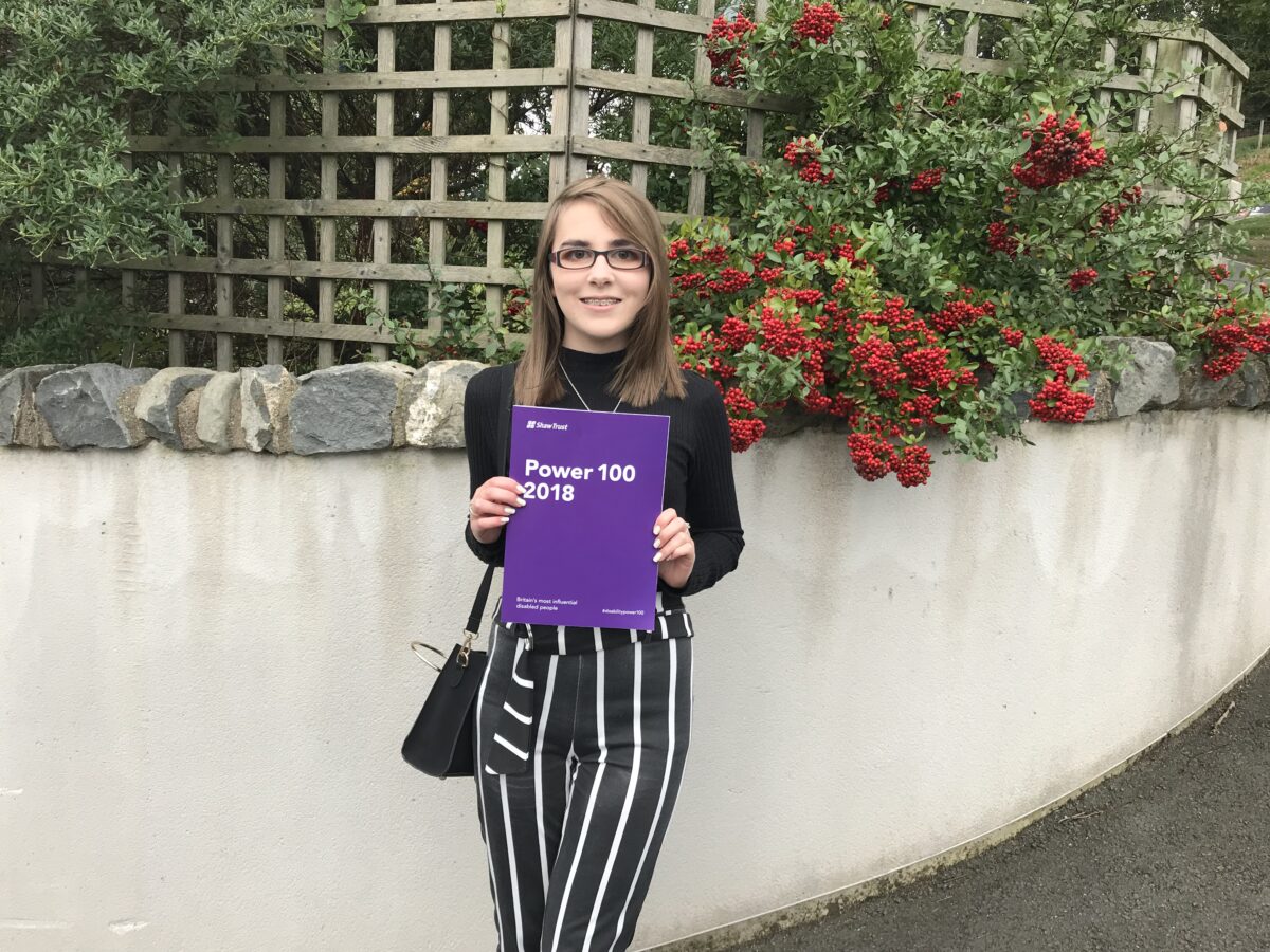 A photo of Elin holding the Shaw Trust disability power list 2018.