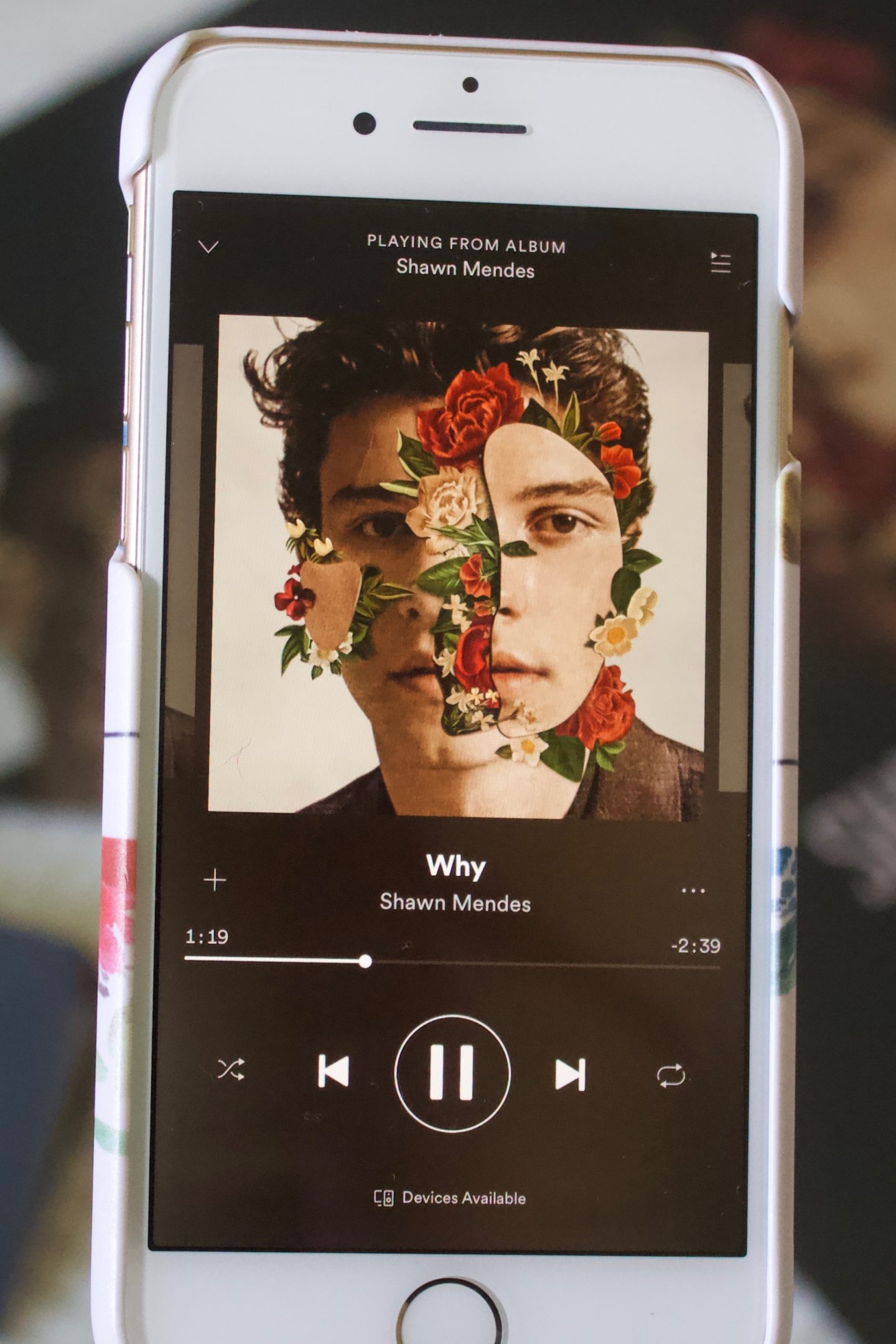 A portrait photo of my phone which shows that the song 'Why' is playing