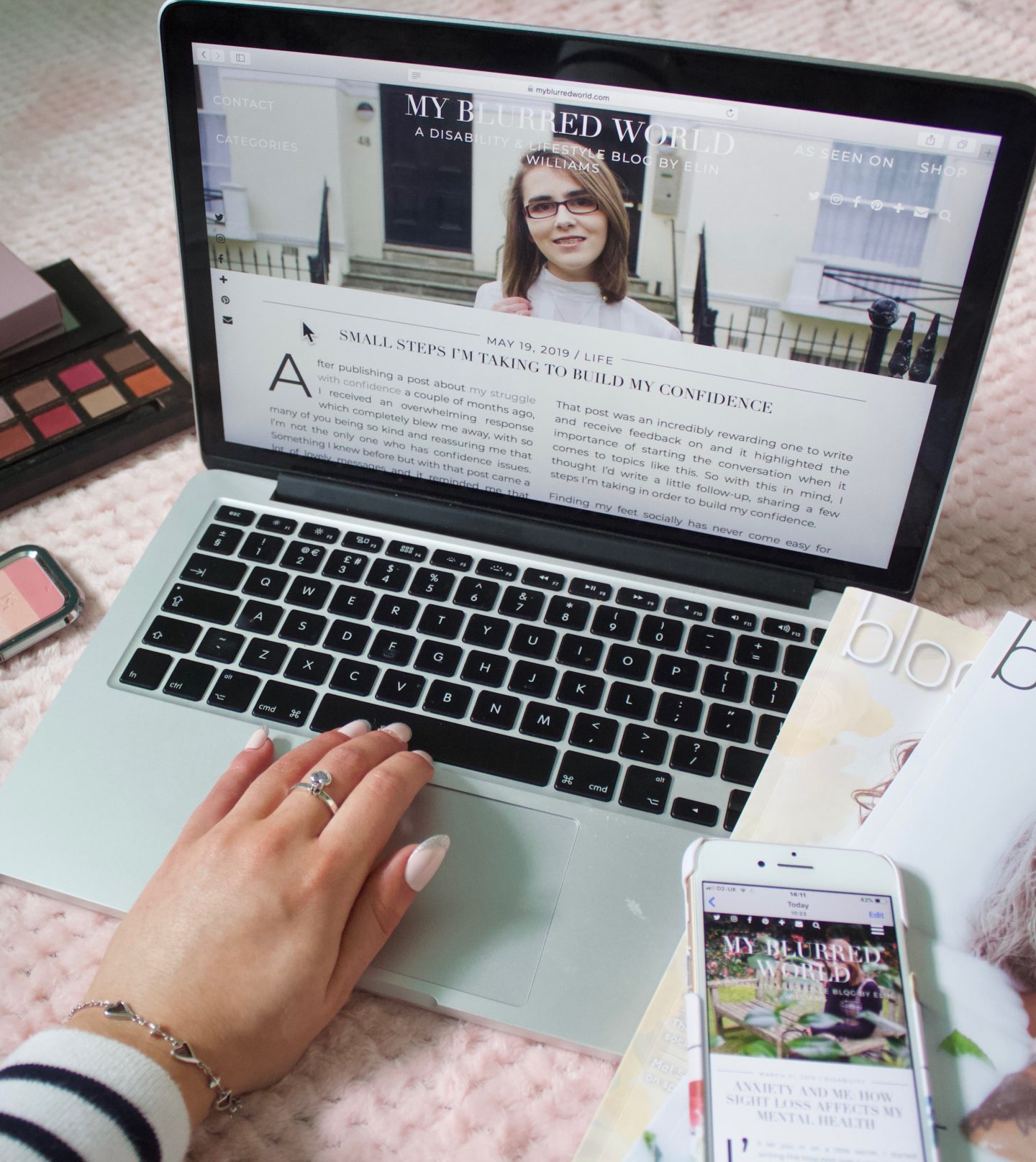 Am I sharing too much online? - A photo of one of my blog posts showing on my laptop screen, my hand is on the keyboard as if I'm typing something