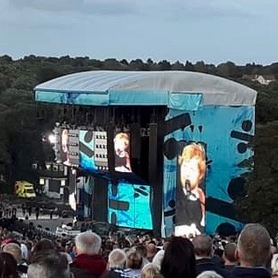 A photo of the stage at Roundhay Park, Ed Sheeran can be seen on the big screens