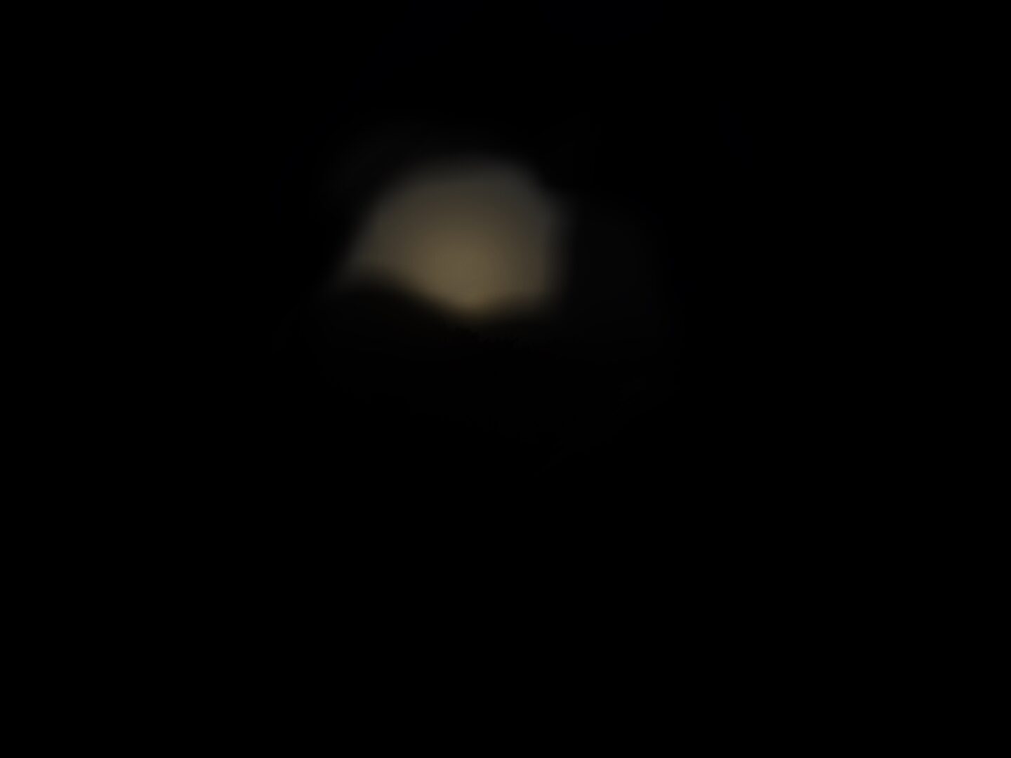 What I see: The view is completely dark apart from a small spec of the moon's light which is very blurry