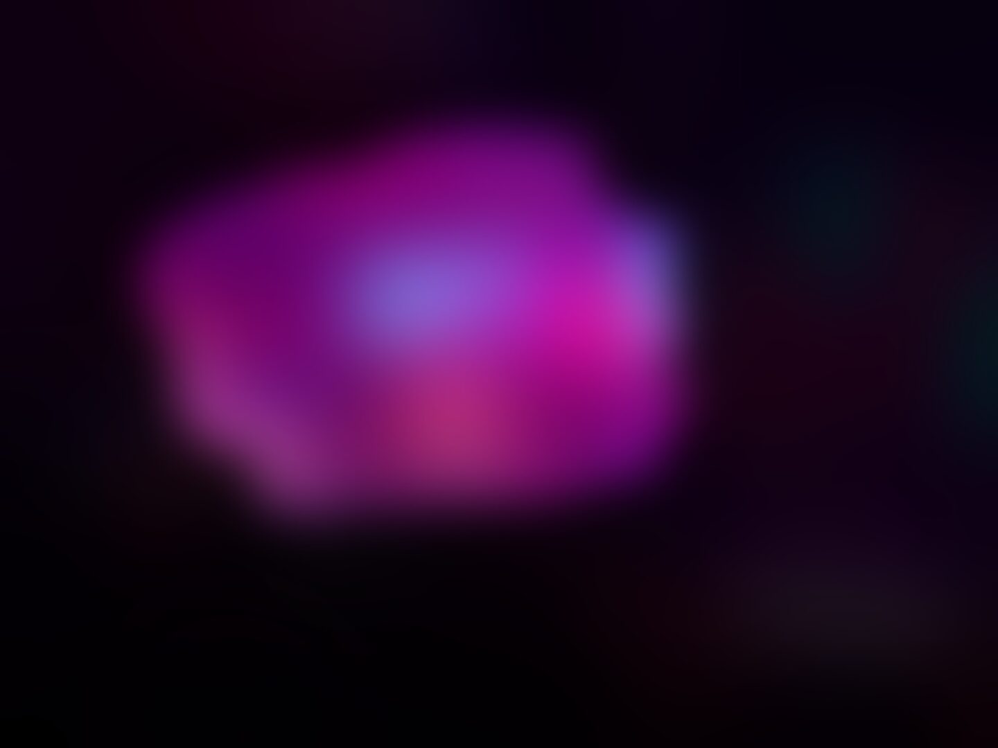 What I see: Most of the view is dark with only a splash of the bright pink light visible in the centre, this is extremely blurred meaning that the other colours on stage cannot be seen as they merge into one