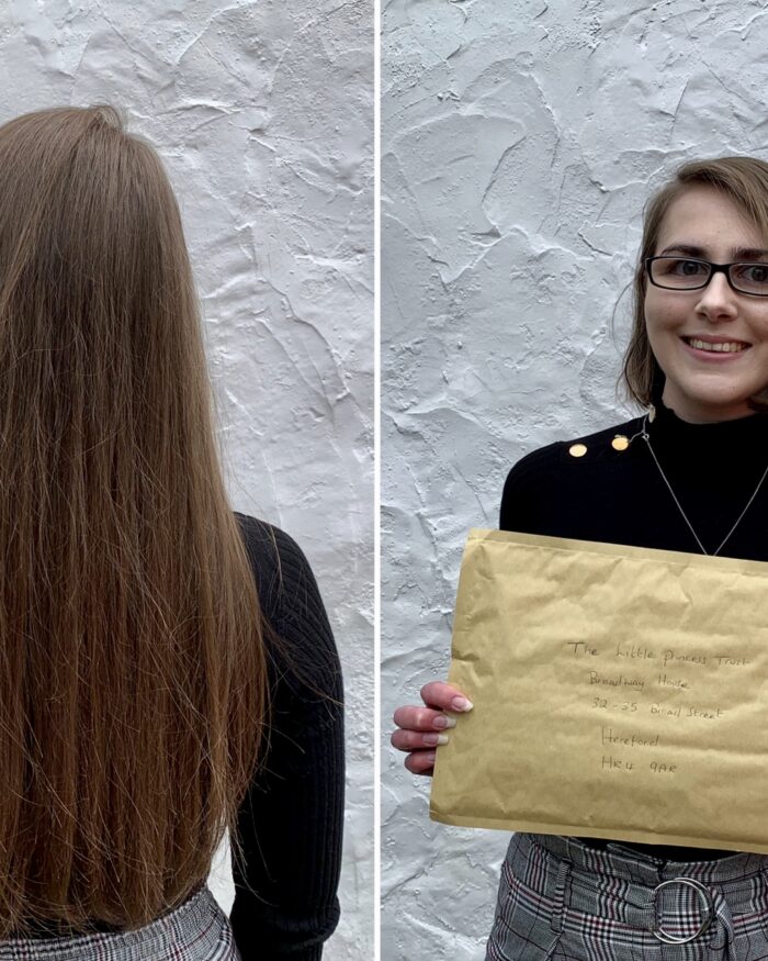 Before and after photos of Elin side by side. The left shows her long brown hair cascading down her back whilst the one on the right shows her with a bob that’s styled to curve towards her face at the front. Strands on the right have been tucked behind her ear. She also holds a brown envelope with The Little Princess Trust address on it. Elin wears a black high neck top with gold buttons along the left shoulder which are visible now all the hair is gone, and has paired the top with grey check trousers. She stands in front of a white wall in both shots.